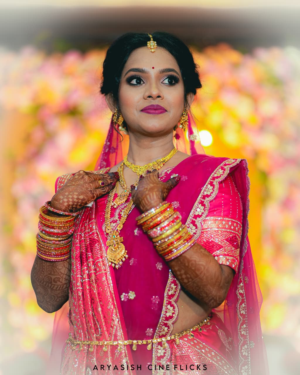 Gilded Memories - Cinematic frame showing professional wedding videography by Aryasish Cine Flicks.
